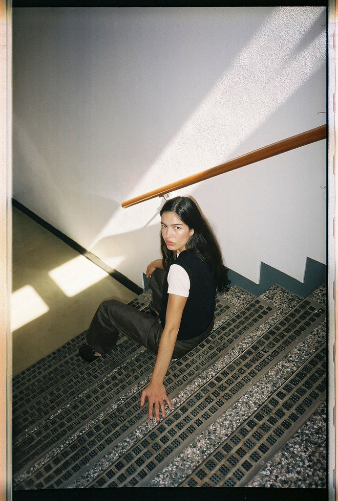 Girl Sitting on Stairwell