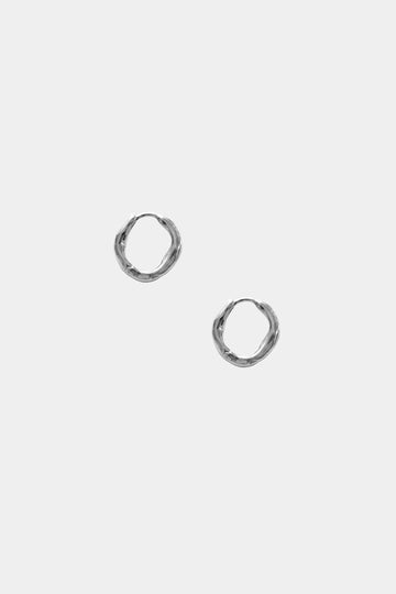 Pair of silver hoop earrings on a light gray background